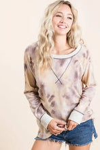 A soft bibi tie dye terry pull over sweatshirt in muted beige with contrast stitching and white ribbed neckline and cuffs