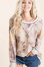 A soft bibi tie dye terry pullover sweatshirt in muted beige and gray with contrast stitching and white ribbed trim