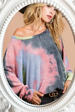 A soft bibi tie dye terry top with vibrant pink blue gray colors featuring dolman sleeves and off the shoulder design