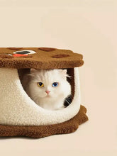Cozy biscuit style pet nest resembling plush chocolate cookie bed