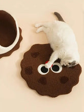 Brown fluffy biscuit style pet nest with white black eyes