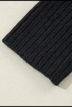 Black ribbed knit scarf with textured pattern in cardigan sweater