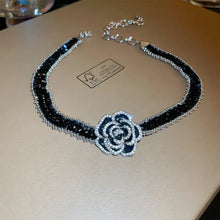 Black and silver alloy crystal rose necklace with camellia pendant