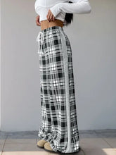 Black and white plaid wide-leg drawstring shorts with side slit