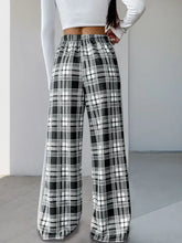 Black and white plaid wide-leg drawstring shorts with high waist