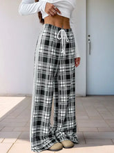 Black and white plaid wide-leg drawstring pants with pattern