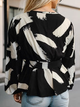 Black and White Wrap Blouse with Belted Waist and Medium Sleeve Length