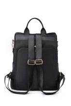 Black beaded backpack with gold zipper pocket and adjustable straps