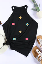 Black floral tank top with gold buttons and knot front