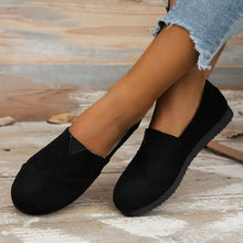 Pair of black round toe flats slip-on canvas shoes with flat sole