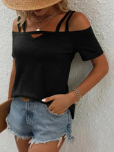 Black double spaghetti straps short sleeve top with V-neck cutout and denim shorts