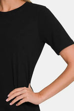 Woman in black crew neck short sleeve t-shirt