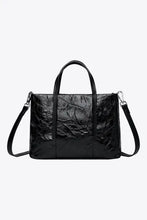 Black crinkled patent leather handbag with detachable shoulder strap
