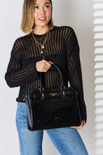 Black crocodile embossed leather handbag with gold hardware