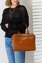 Tan crocodile embossed leather handbag with gold hardware