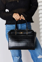Black crocodile-embossed leather handbag with gold tone hardware