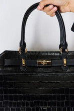 Black crocodile embossed leather handbag with gold hardware