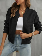 Black cropped textured bomber jacket for women with ribbed detailing and zippered front