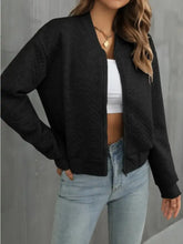 Black cropped bomber jacket for women with gold zipper and pocket details