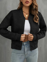 Black textured bomber jacket for women with zipper and ribbed cuffs