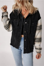 Black denim jacket with fur sleeves, raw hem, and distressed details