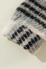 Plaid wool scarf with black and white stripes on light pink background
