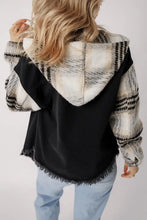 Stylish black denim jacket with fur sleeves and raw hem