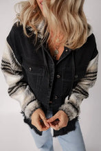 Black denim vest with fur sleeves, button closure, and raw hem