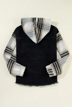 Black and white plaid hoodie with frayed raw hem edges and fleece lining