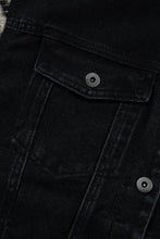 Black denim jacket with fur sleeves, raw hem, and distressed pockets