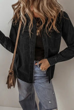 Black denim jacket with distressed details, button closure, and patch pockets
