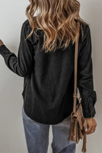Black velvet blouse with lace detailing, long sleeves, and distressed denim jacket