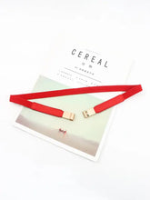 Black elastic skinny belt with gold buckle and red leather choker