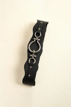 Black elastic waist belt with silver zinc alloy buckle and O-ring detailing