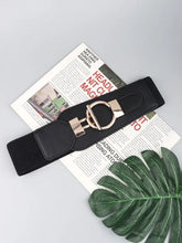 Black elastic wide belt with gold buckle and textured weave