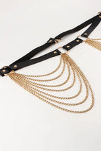 Black faux leather belt with gold chains, buckle, and fringe