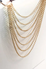 Gold layered chain keychain with intricate links on black faux leather belt