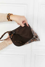 Brown and black leopard print leather wristlet clutch bag with gold hardware