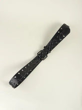 Black grommet PU leather belt with double buckle and dangling strap
