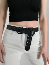 Black grommet PU leather belt with double buckle over white pants