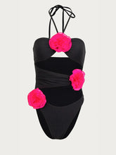 Black Halter Swimsuit with Pink Floral Accents and Cutout Detail