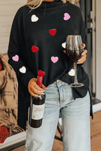 Black heart patched turtleneck top with pink, red, white hearts
