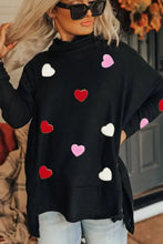 Black heart patched turtleneck sweater with red pink hearts and wide-leg jeans set