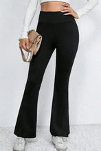 Black high-waisted flared pants with stretchy waistband and soft fabric