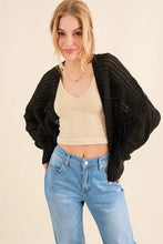 Black knitting bolero cardigan with cable knit, silver sequins, and pockets