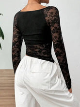 Black lace long sleeve crop top with floral pattern and scoop neckline