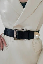 Black leather belt with large silver zinc alloy buckle