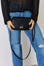 Black leather crossbody bag with gold hardware and adjustable strap from David Jones