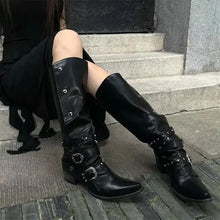 Black leather knee-high studded boots with silver buckles