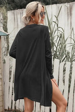 Charcoal gray long sleeve longline cardigan with side slits and pocket detail